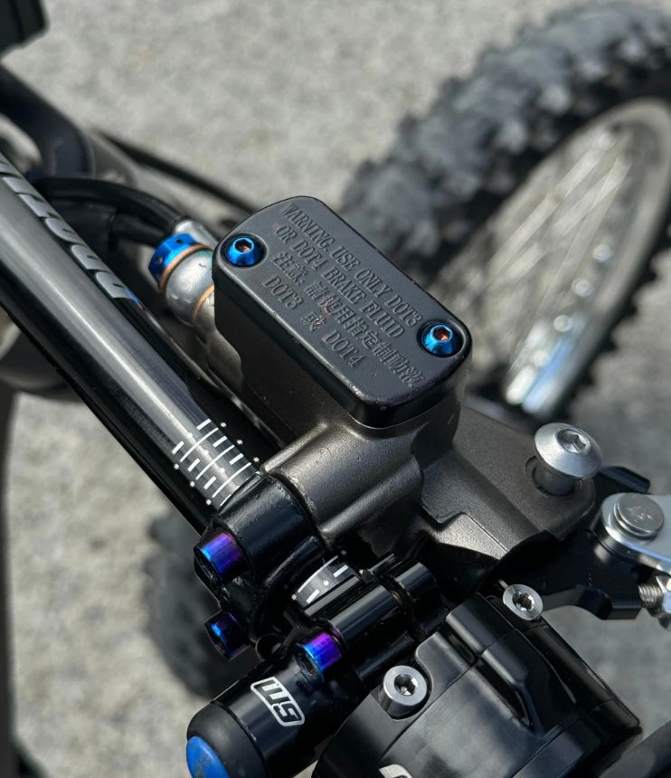 Brake reservoir cap titanium bolts